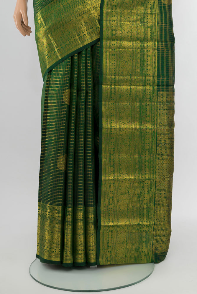 Pleats and pallu of Mint Green Kanjivaram Silk Saree with Zari Butta on the body and Silk Border. 