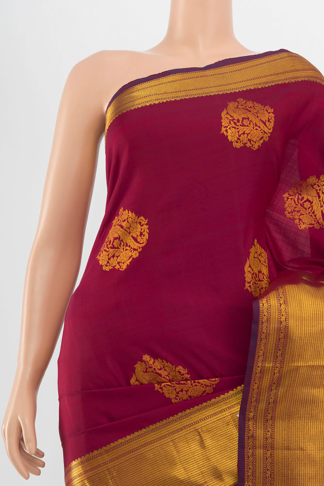 Border image of Pure Silk Pure Zari Maroon Kanjivaram Saree with Zari Butta on the body and Silk Border. 