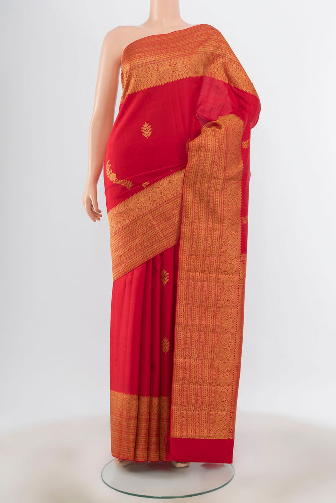 Red Kanjivaram Silk Saree with Zari Butta on the body and Silk Border.  displayed on a mannequin