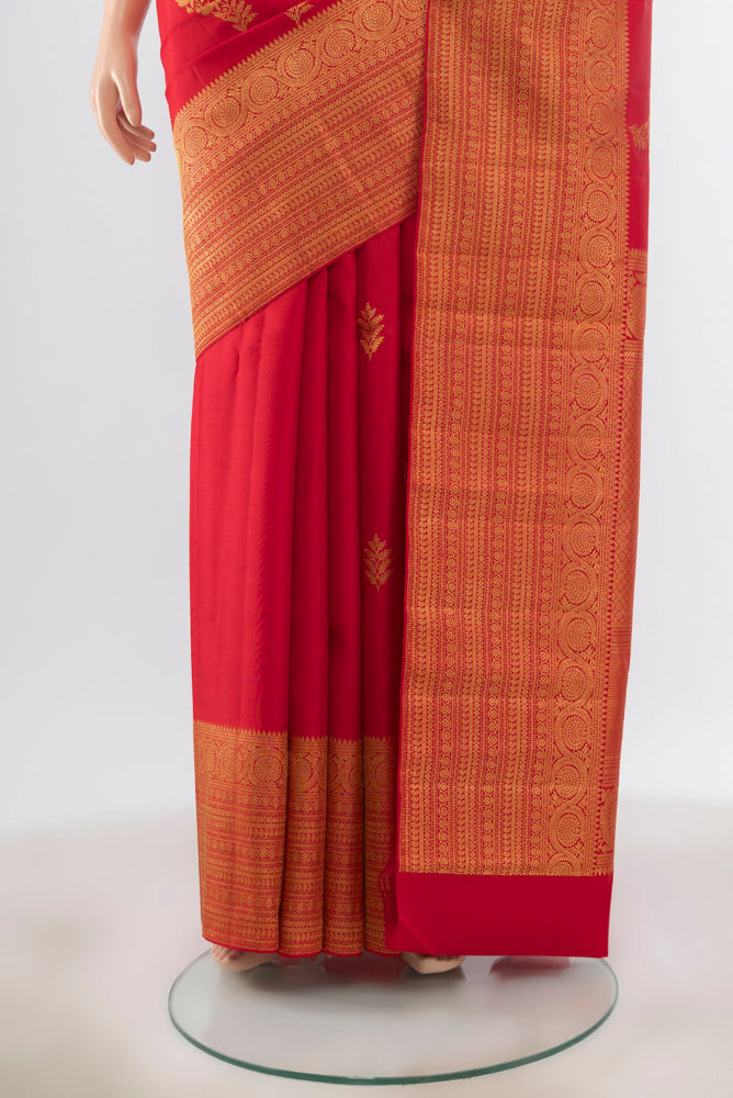 Pleats and pallu of Red Kanjivaram Silk Saree with Zari Butta on the body and Silk Border. 
