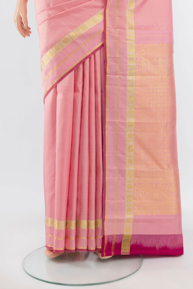 Pleats and pallu of Pure Silk Pure Zari Rose Gold Kanjivaram Saree with Zari Brocade on the body and Silk Border. 
