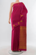 Dark Pink Kanchipuram Silk Saree with Plain Body and Thin Zari Line.  displayed on a mannequin