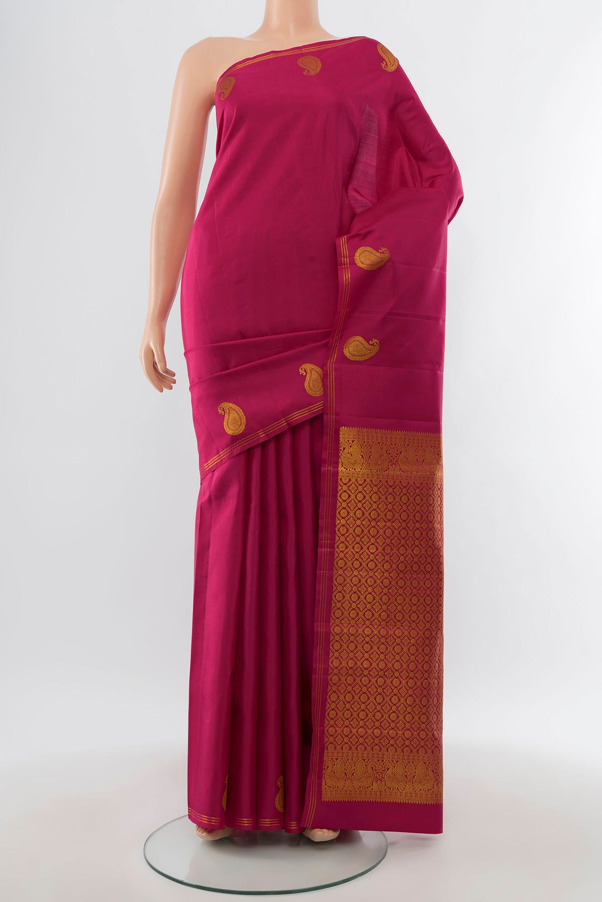 Dark Pink Kanchipuram Silk Saree with Plain Body and Thin Zari Line.  displayed on a mannequin