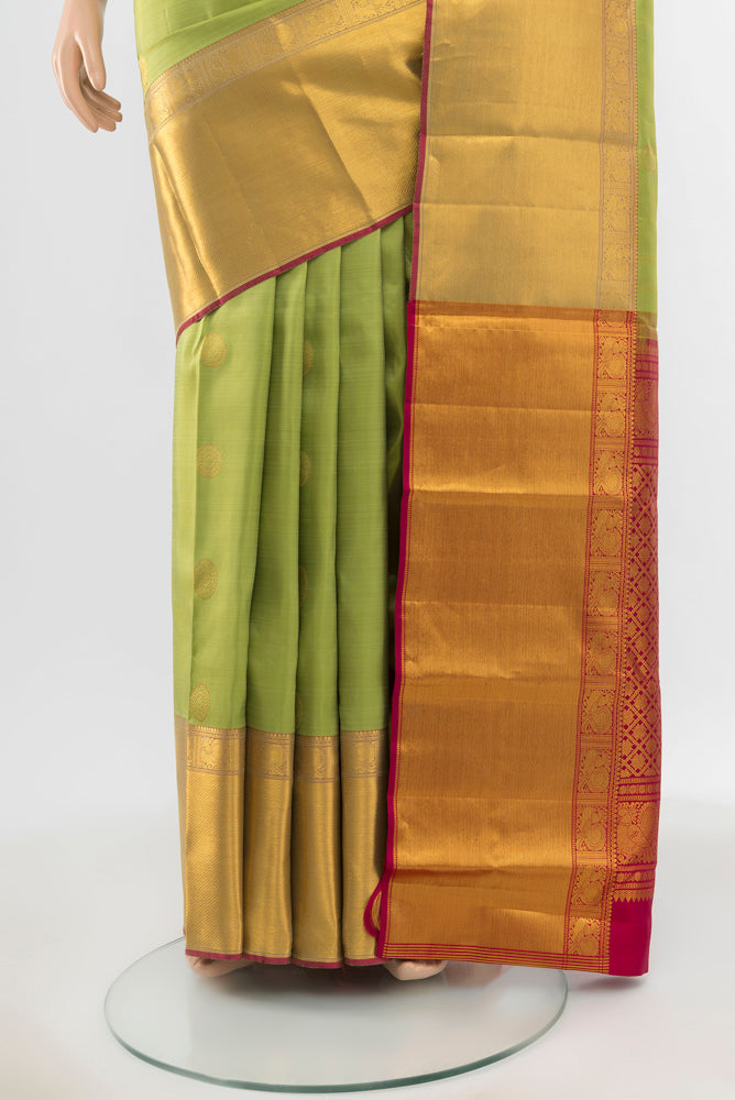 Pleats and pallu of Pure Silk Pure Zari Pista Green Kanjivaram Saree with Zari Butta on the body and Silk Border. 