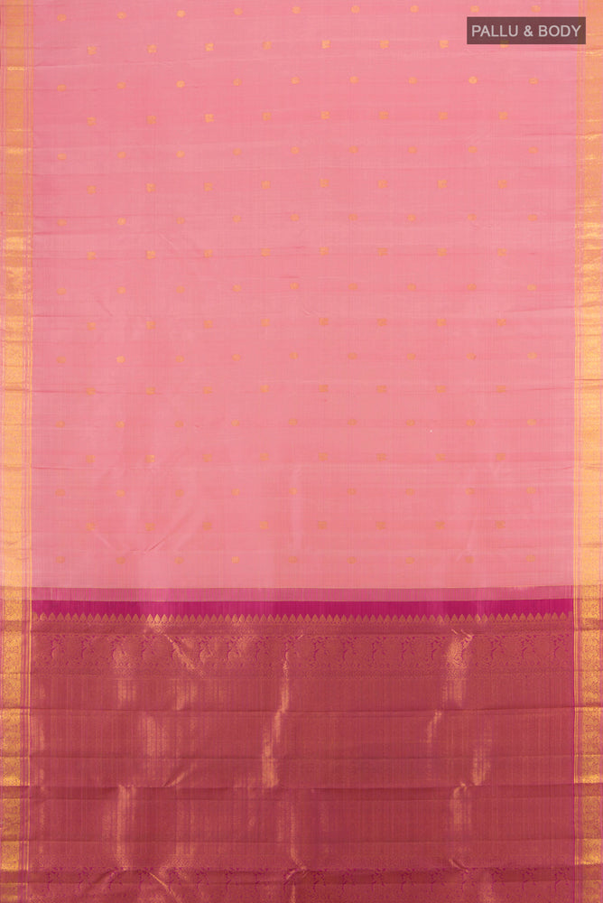 Flat view of Rose Gold Kanjivaram Silk Saree with Zari Butta on the body and Silk Border. 