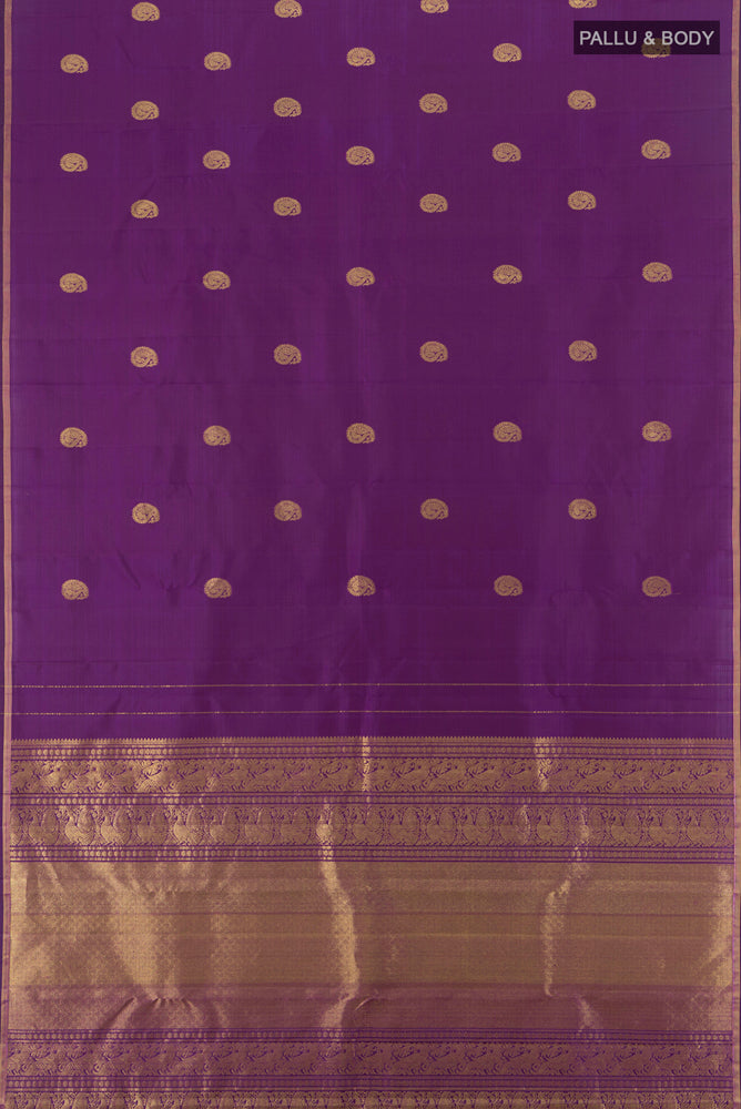 Flat view of Pure Silk Pure Zari Violet Kanchipuram Saree with Zari Butta on the body and Silk Border. 