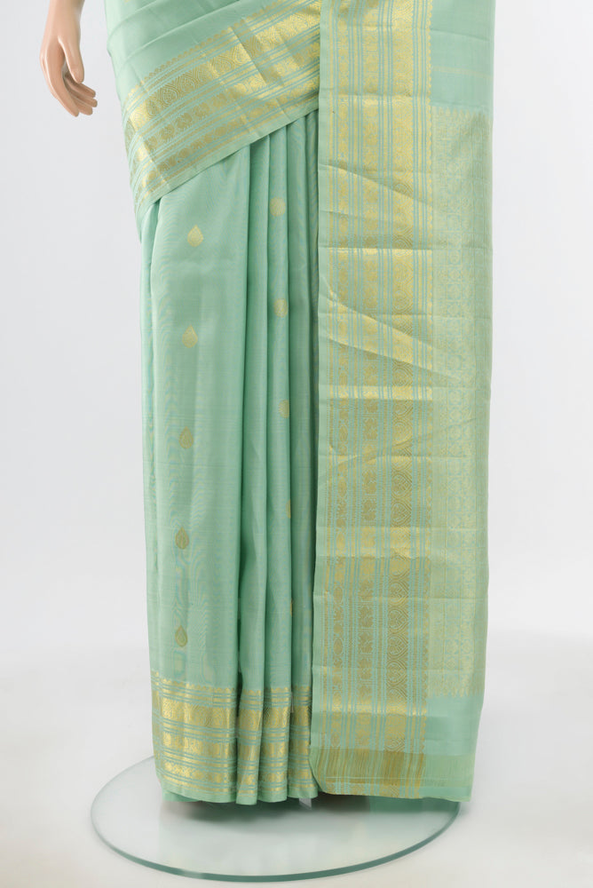Pleats and pallu of Pure Silk Pure Zari Pista Green Kanjivaram Saree with Zari Butta on the body and Silk Border. 