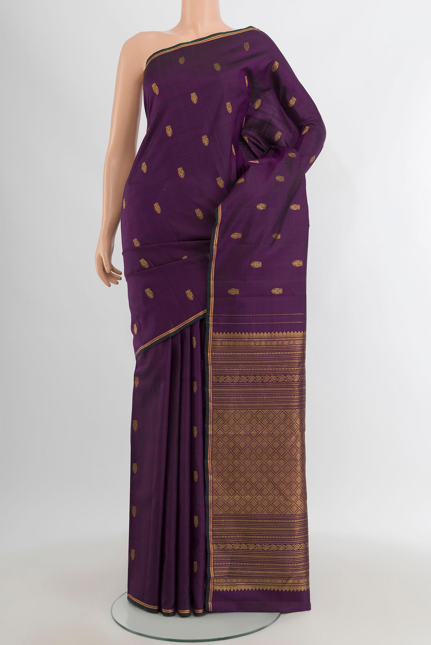 Violet Kanchipuram Silk Saree with Zari Butta on the body and Zari Border.  displayed on a mannequin
