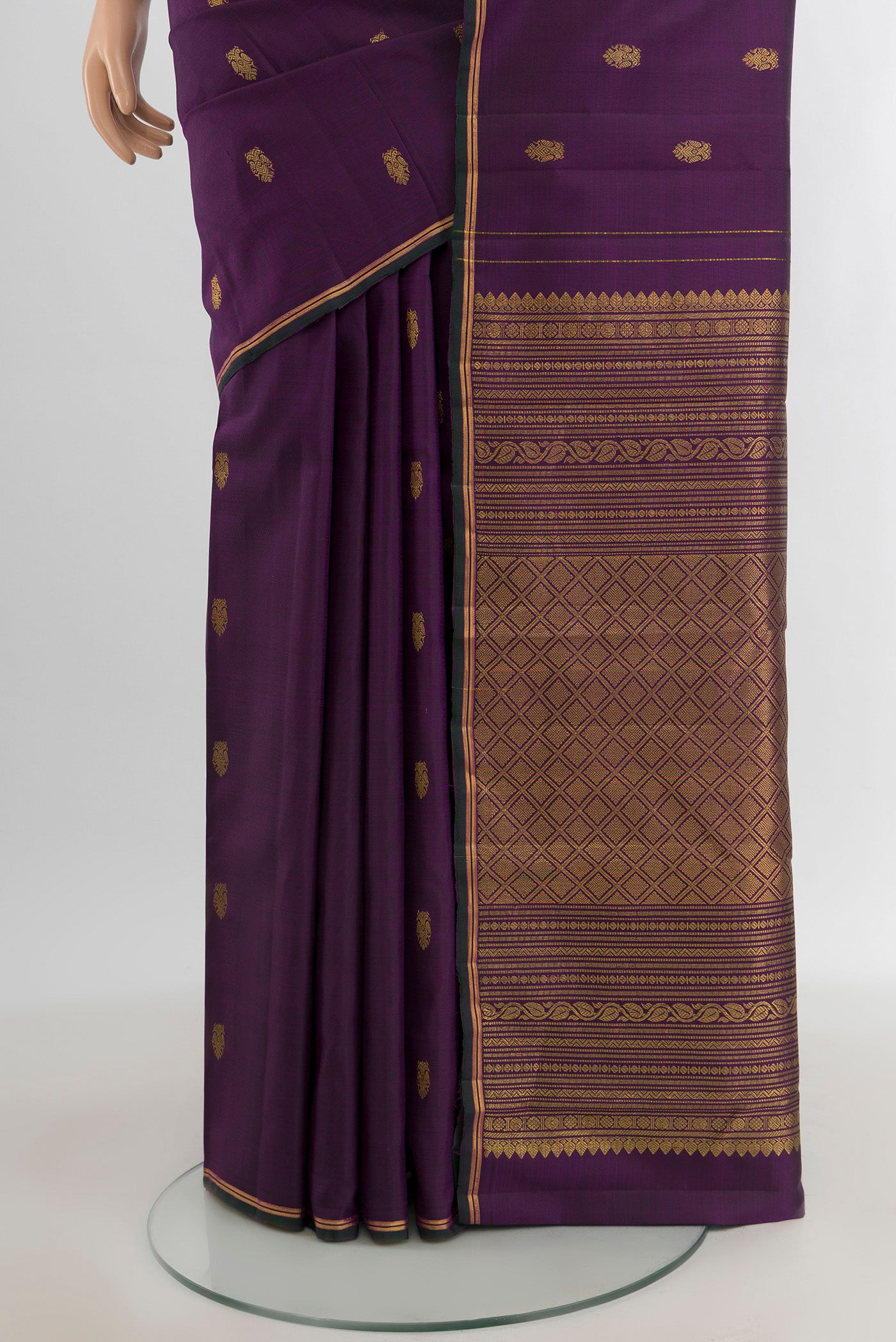 Pleats and pallu of Violet Kanchipuram Silk Saree with Zari Butta on the body and Zari Border. 