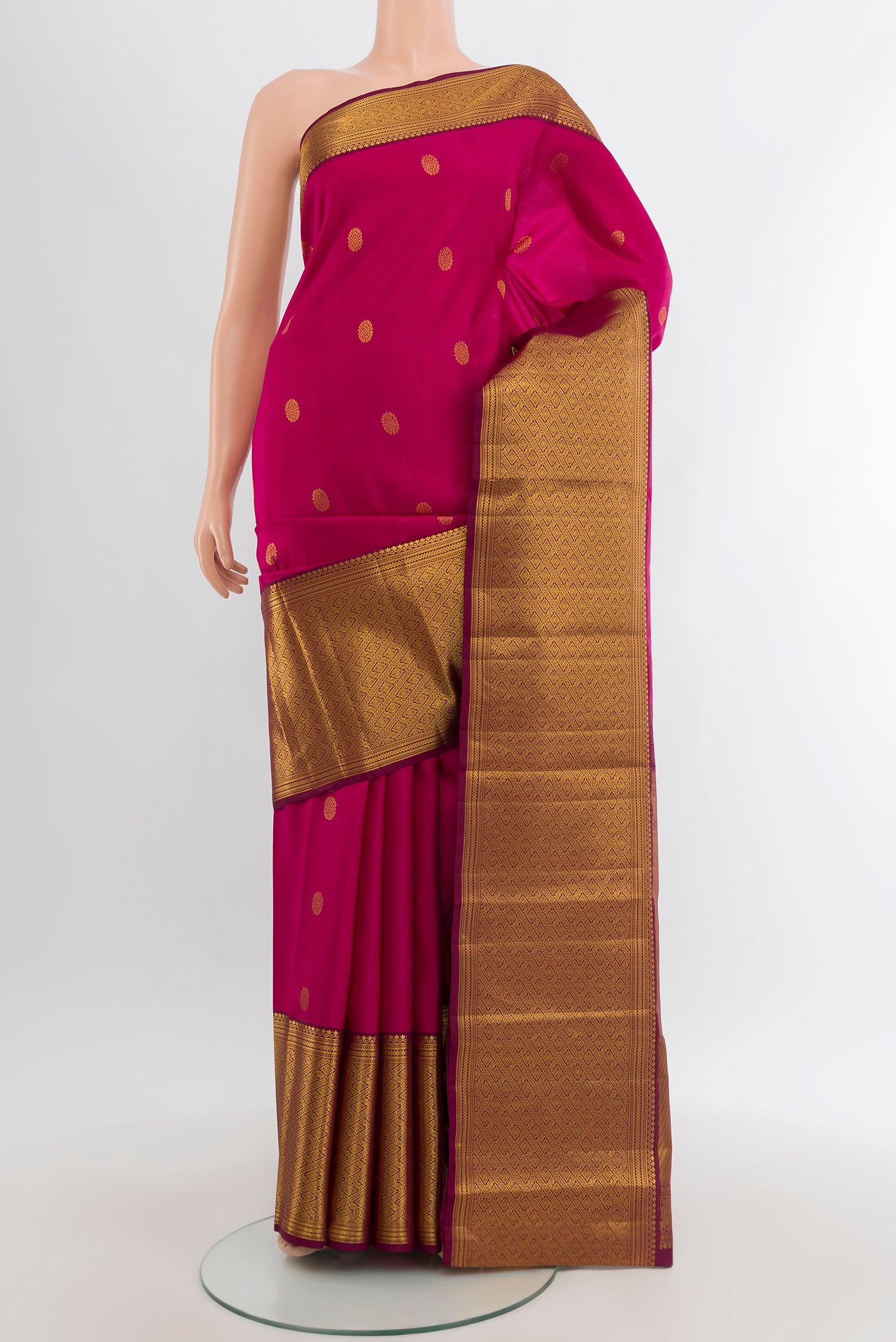 Dark Pink Kanjivaram Silk Saree with Zari Butta on the body and Zari Border.  displayed on a mannequin