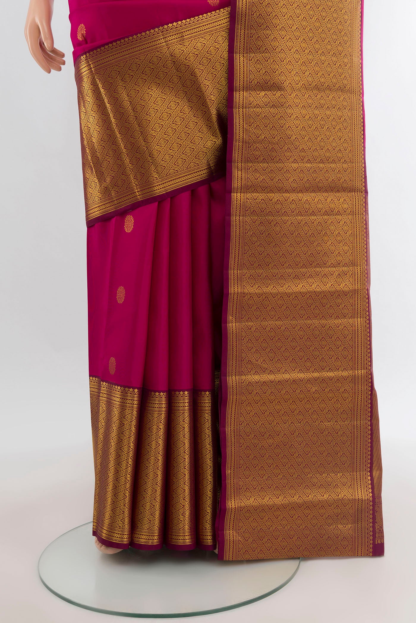 Pleats and pallu of Dark Pink Kanjivaram Silk Saree with Zari Butta on the body and Zari Border. 