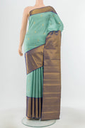 Pure Silk Pure Zari Teal Kanjivaram Saree with Zari Butta on the body and Silk Border.  displayed on a mannequin