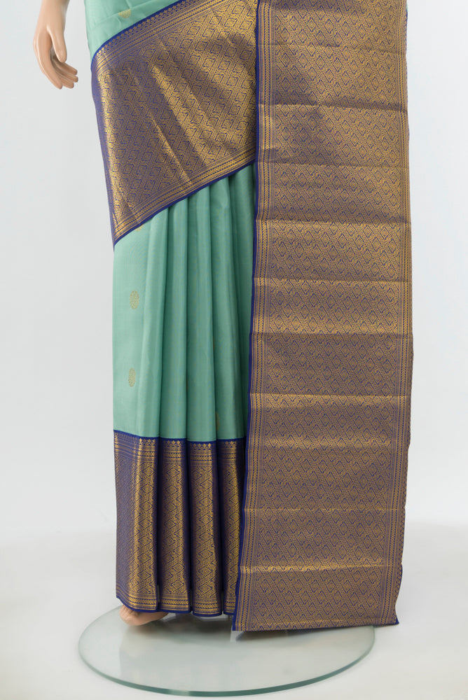 Pleats and pallu of Pure Silk Pure Zari Teal Kanjivaram Saree with Zari Butta on the body and Silk Border. 