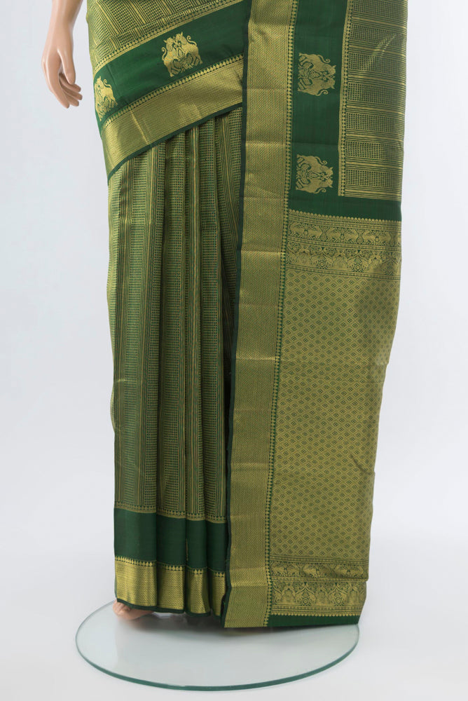 Pleats and pallu of Mint Green Kanjivaram Silk Saree with Zari Butta on the body and Silk Border. 