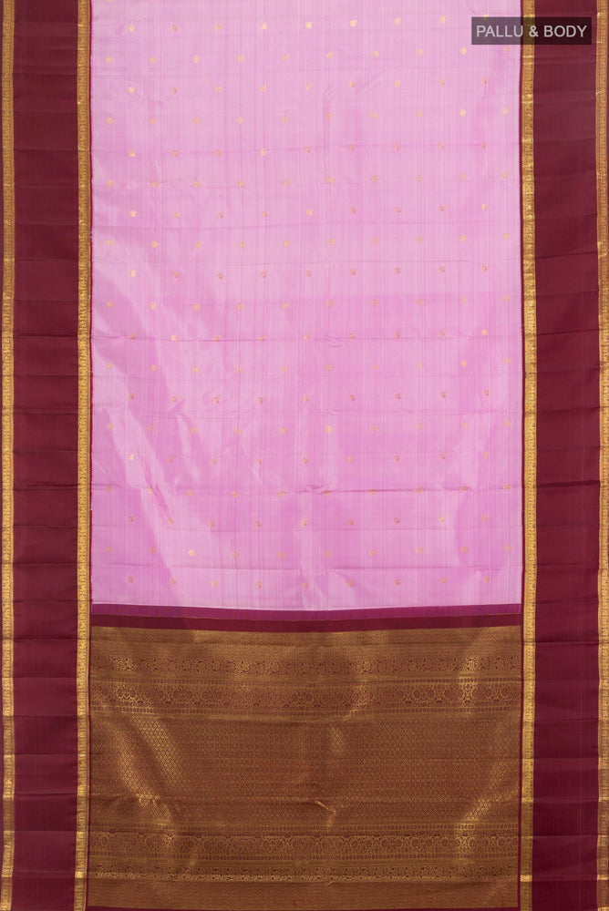 Flat view of Rose Gold Kanjivaram Silk Saree with Zari Butta on the body and Silk Border. 