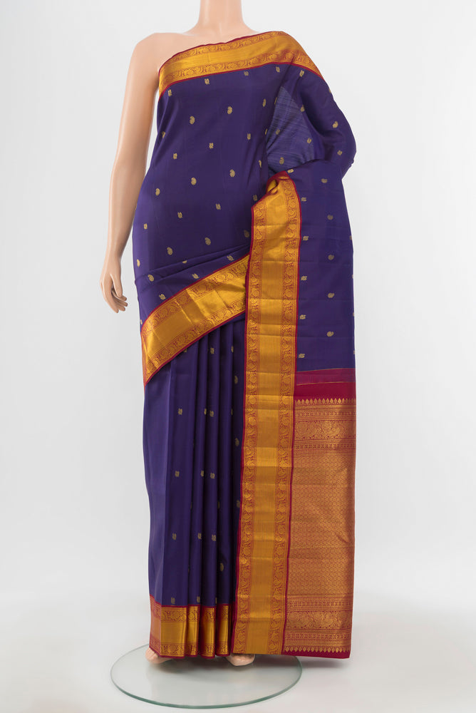 Pure Silk Pure Zari Navy Blue Kanjivaram Saree with Zari Butta on the body and Silk Border.  displayed on a mannequin