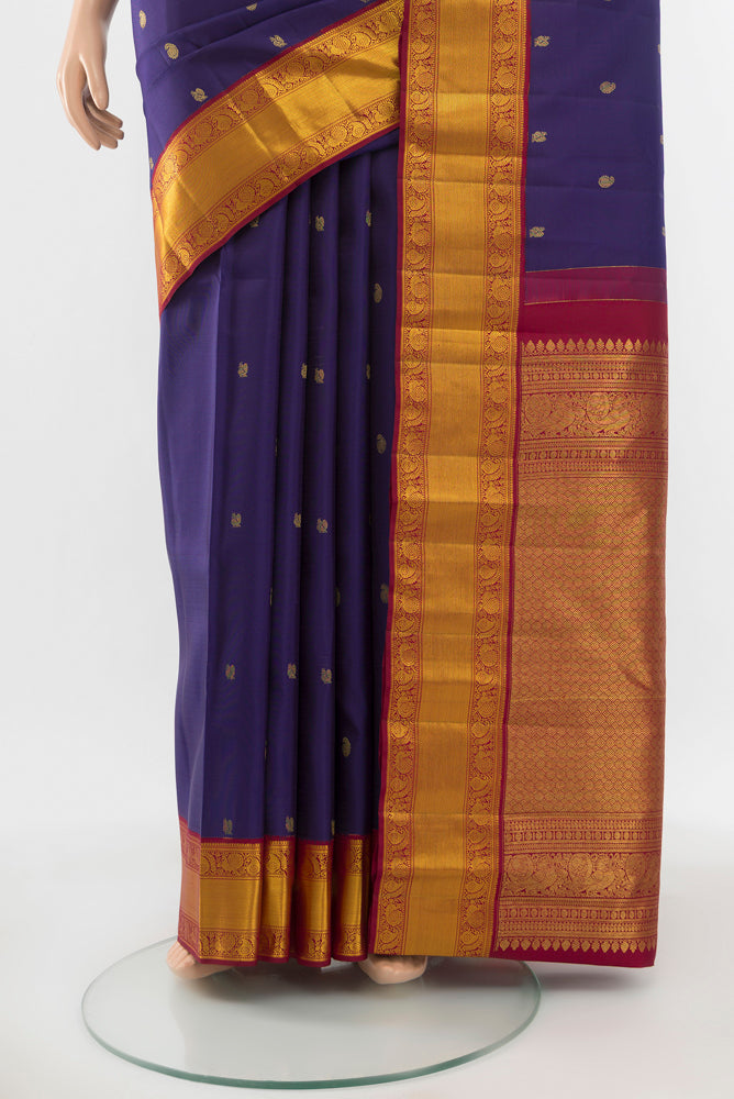Pleats and pallu of Pure Silk Pure Zari Navy Blue Kanjivaram Saree with Zari Butta on the body and Silk Border. 