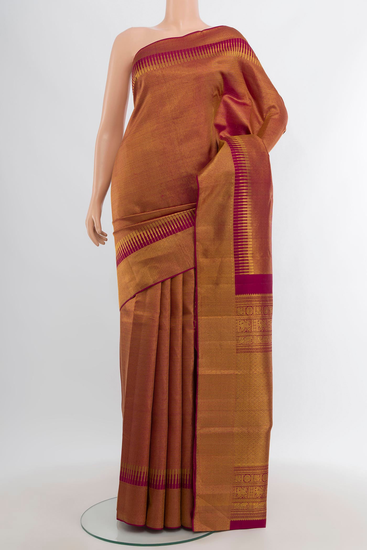 Maroon Kanjivaram Silk Saree with Zari Brocade on the body and Zari Border.  displayed on a mannequin
