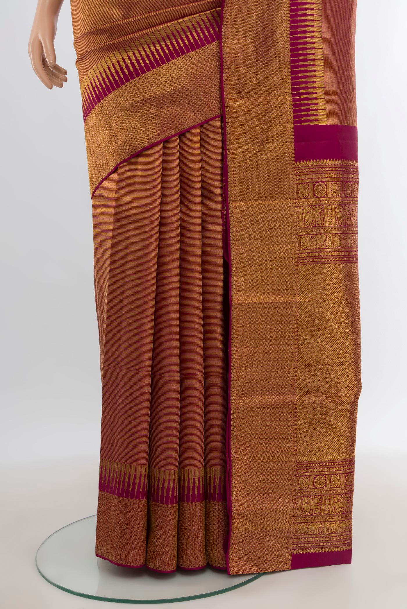 Pleats and pallu of Maroon Kanjivaram Silk Saree with Zari Brocade on the body and Zari Border. 