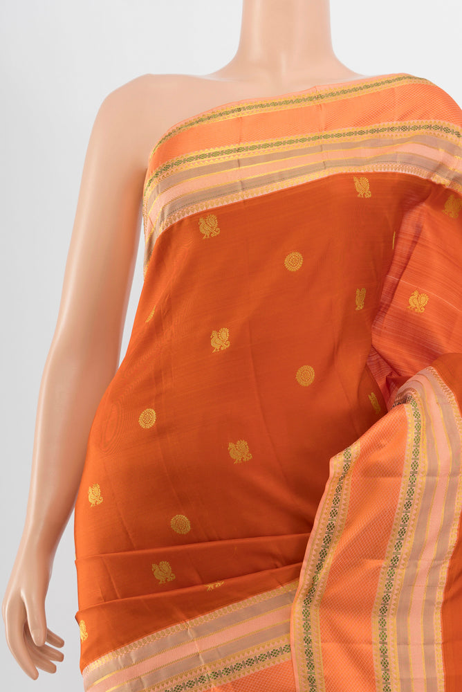 Border image of Pure Silk Pure Zari Rust Kanjivaram Saree with Zari Butta on the body and Silk Border. 
