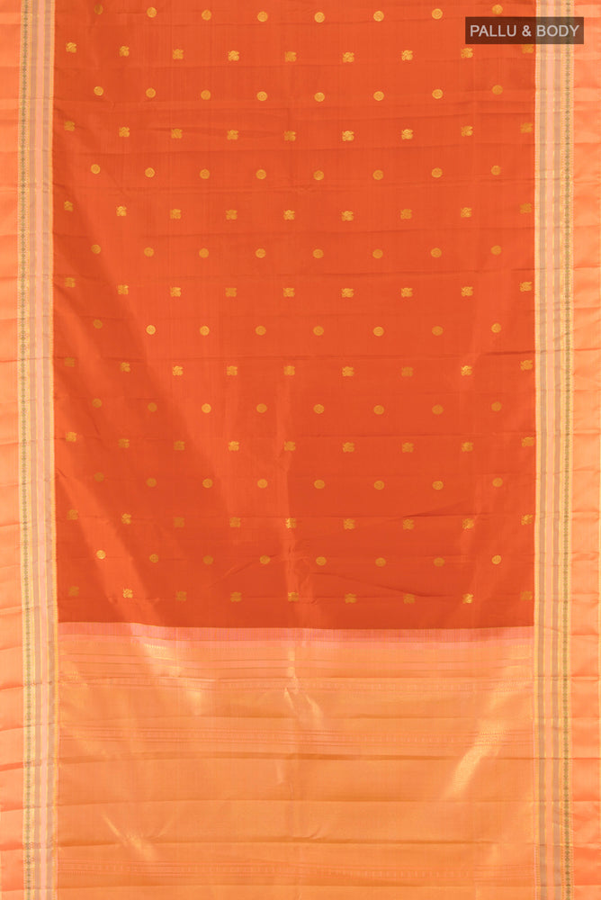 Flat view of Pure Silk Pure Zari Rust Kanjivaram Saree with Zari Butta on the body and Silk Border. 