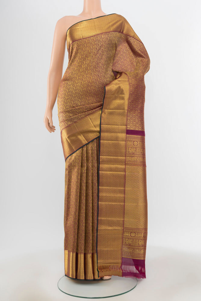 Pure Silk Pure Zari Golden Kanjivaram Saree with Zari Butta on the body and Silk Border.  displayed on a mannequin