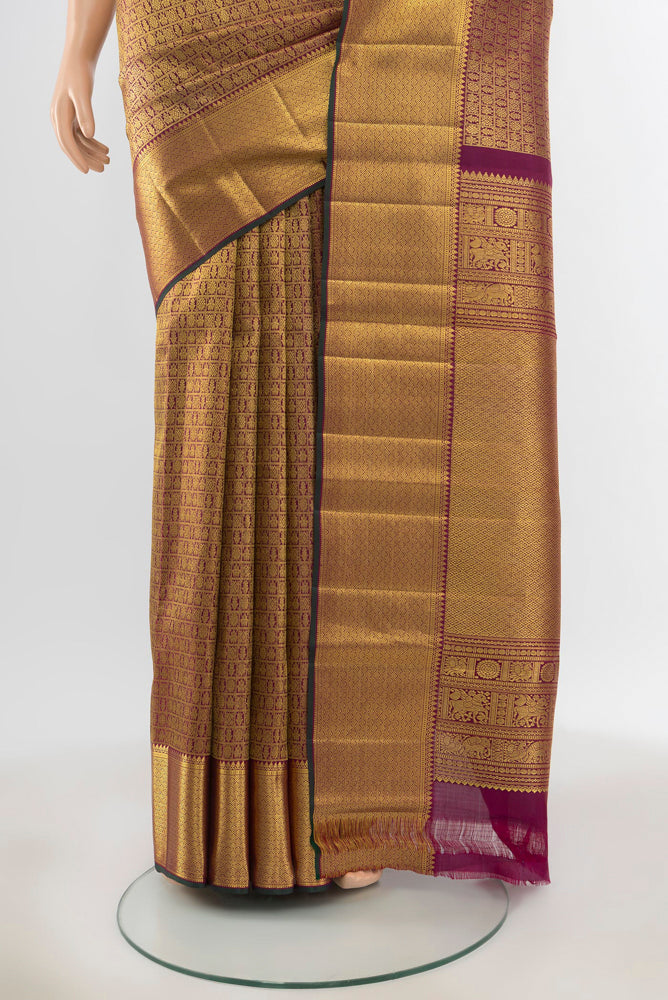 Pleats and pallu of Pure Silk Pure Zari Golden Kanjivaram Saree with Zari Butta on the body and Silk Border. 