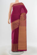 Pure Silk Pure Zari Purple Kanjivaram Saree with Zari Butta on the body and Silk Border.  displayed on a mannequin