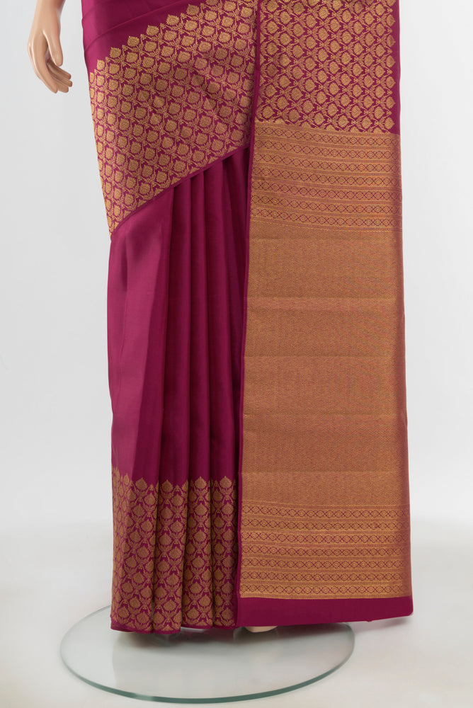 Pleats and pallu of Pure Silk Pure Zari Purple Kanjivaram Saree with Zari Butta on the body and Silk Border. 