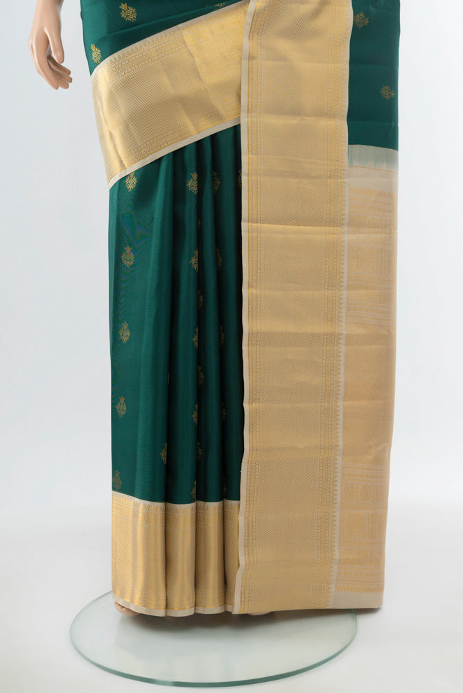 Pleats and pallu of Mint Green Kanjivaram Silk Saree with Zari Butta on the body and Silk Border. 
