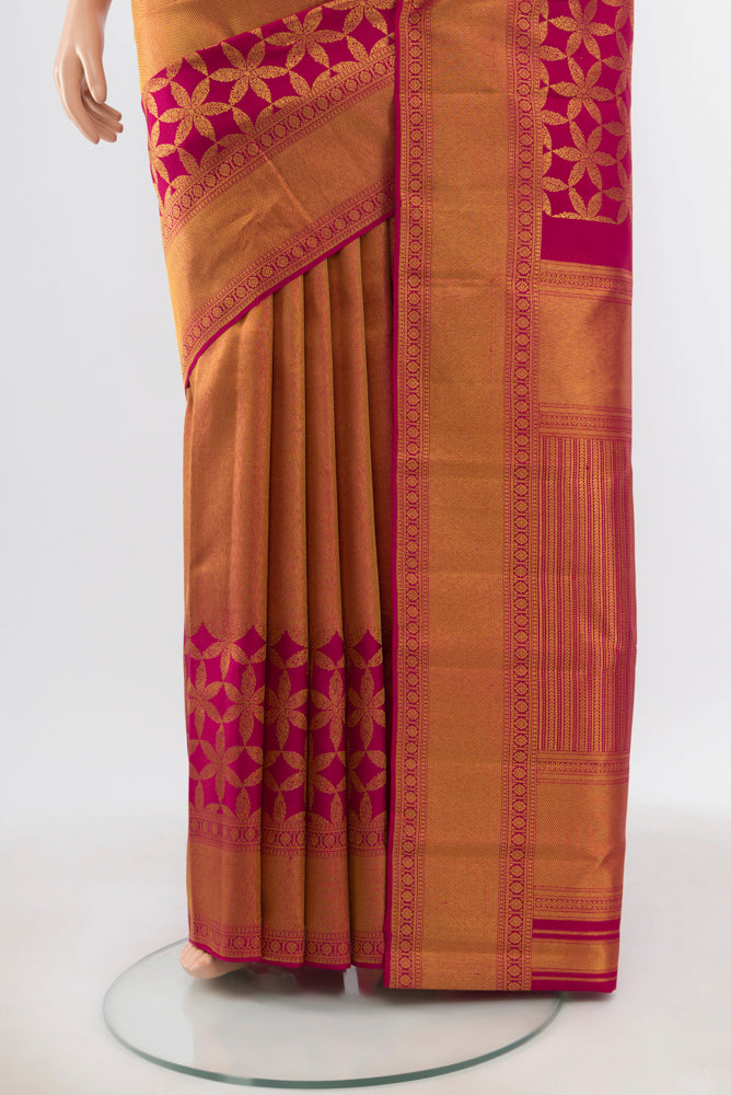 Pleats and pallu of Pure Silk Pure Zari Maroon Kanjivaram Saree with Zari Butta on the body and Silk Border. 