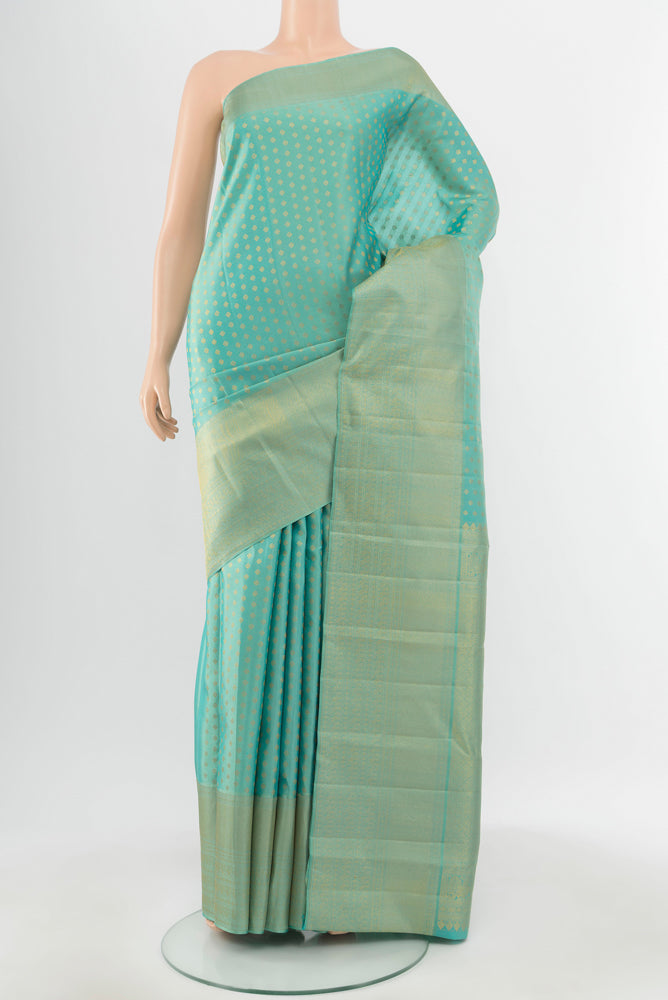 Pure Silk Pure Zari Sky Blue Kanjivaram Saree with Zari Butta on the body and Silk Border.  displayed on a mannequin