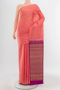 Peach Kanchipuram Silk Saree with Zari Butta on the body and Silk Border.  displayed on a mannequin