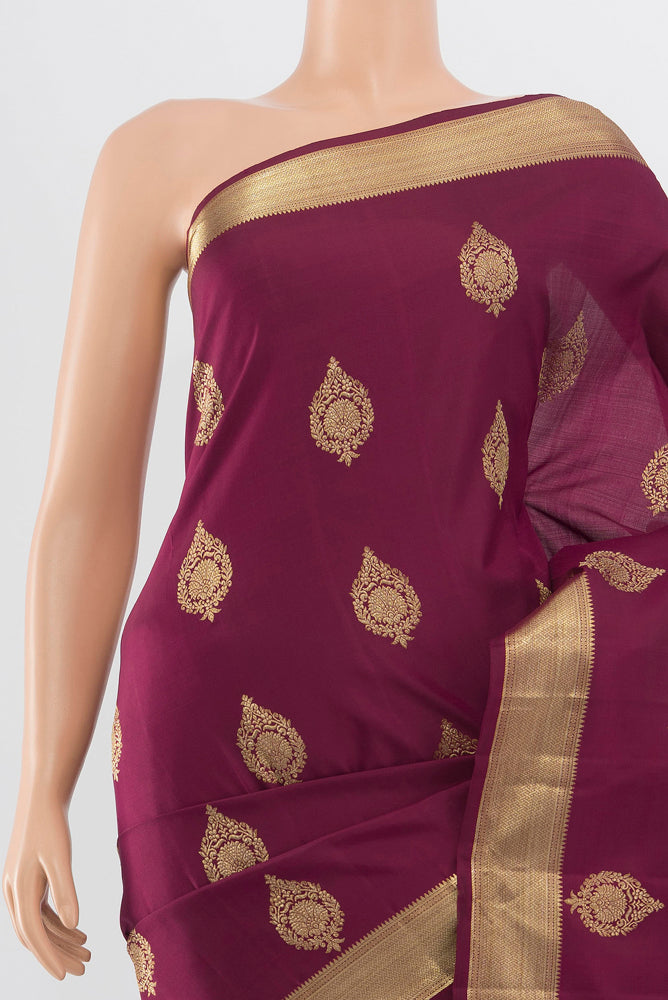 Border image of Pure Silk Pure Zari Maroon Kanjivaram Saree with Zari Butta on the body and Silk Border. 