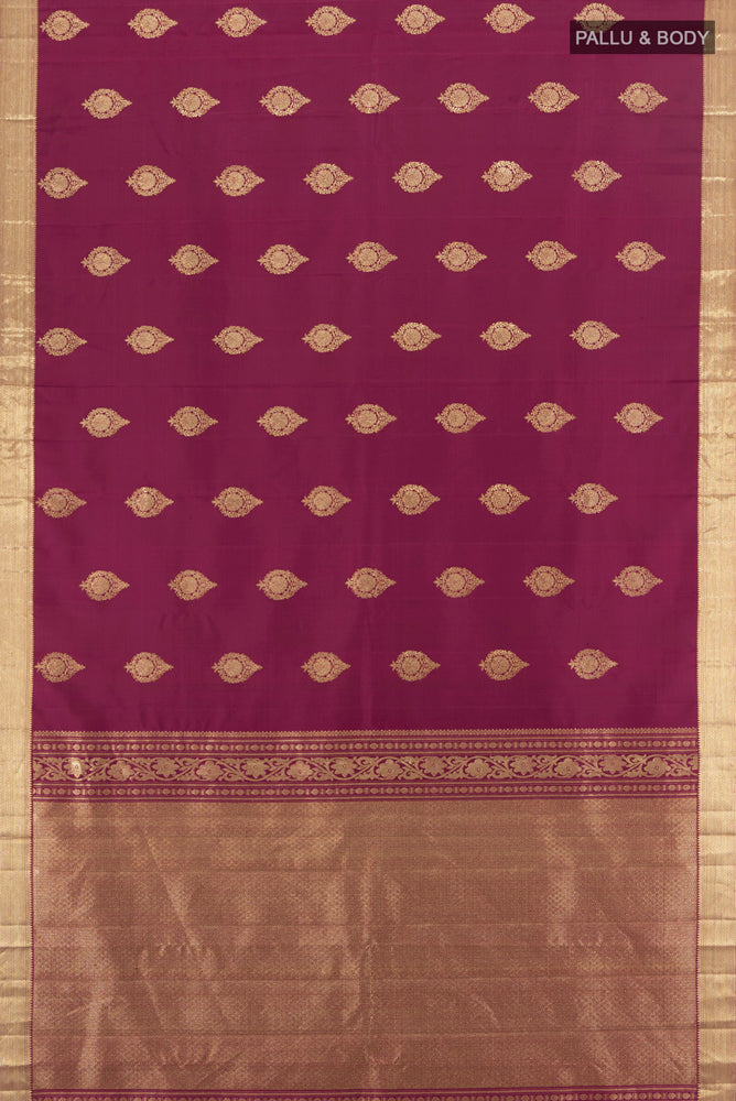 Flat view of Pure Silk Pure Zari Maroon Kanjivaram Saree with Zari Butta on the body and Silk Border. 