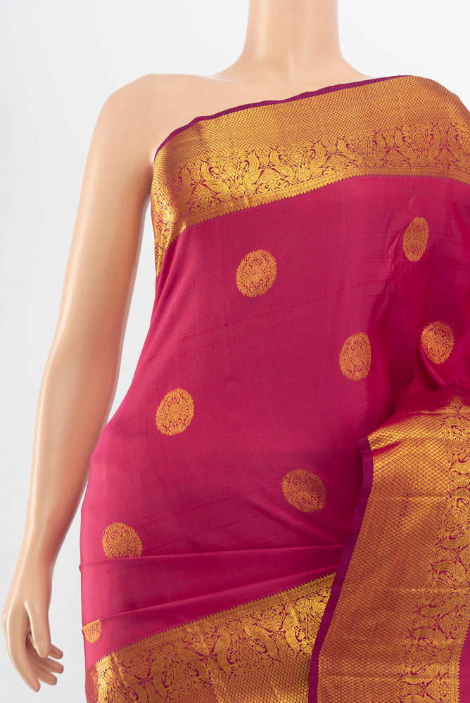 Border image of Pure Silk Pure Zari Dark Pink Kanjivaram Saree with Zari Butta on the body and Silk Border. 