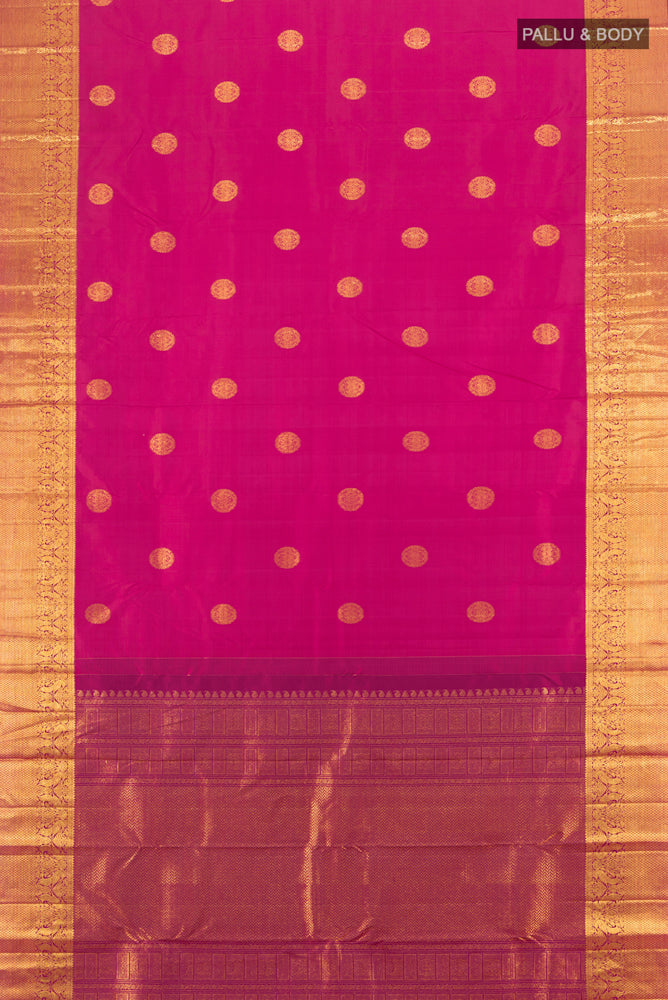 Flat view of Pure Silk Pure Zari Dark Pink Kanjivaram Saree with Zari Butta on the body and Silk Border. 