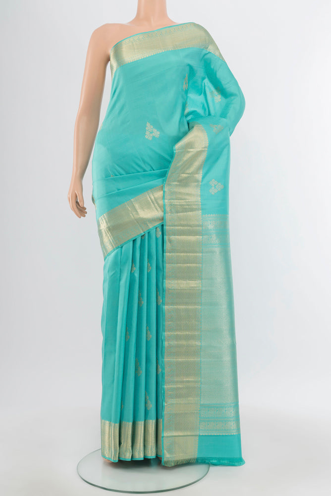 Pure Silk Pure Zari Sky Blue Kanjivaram Saree with Zari Butta on the body and Silk Border.  displayed on a mannequin