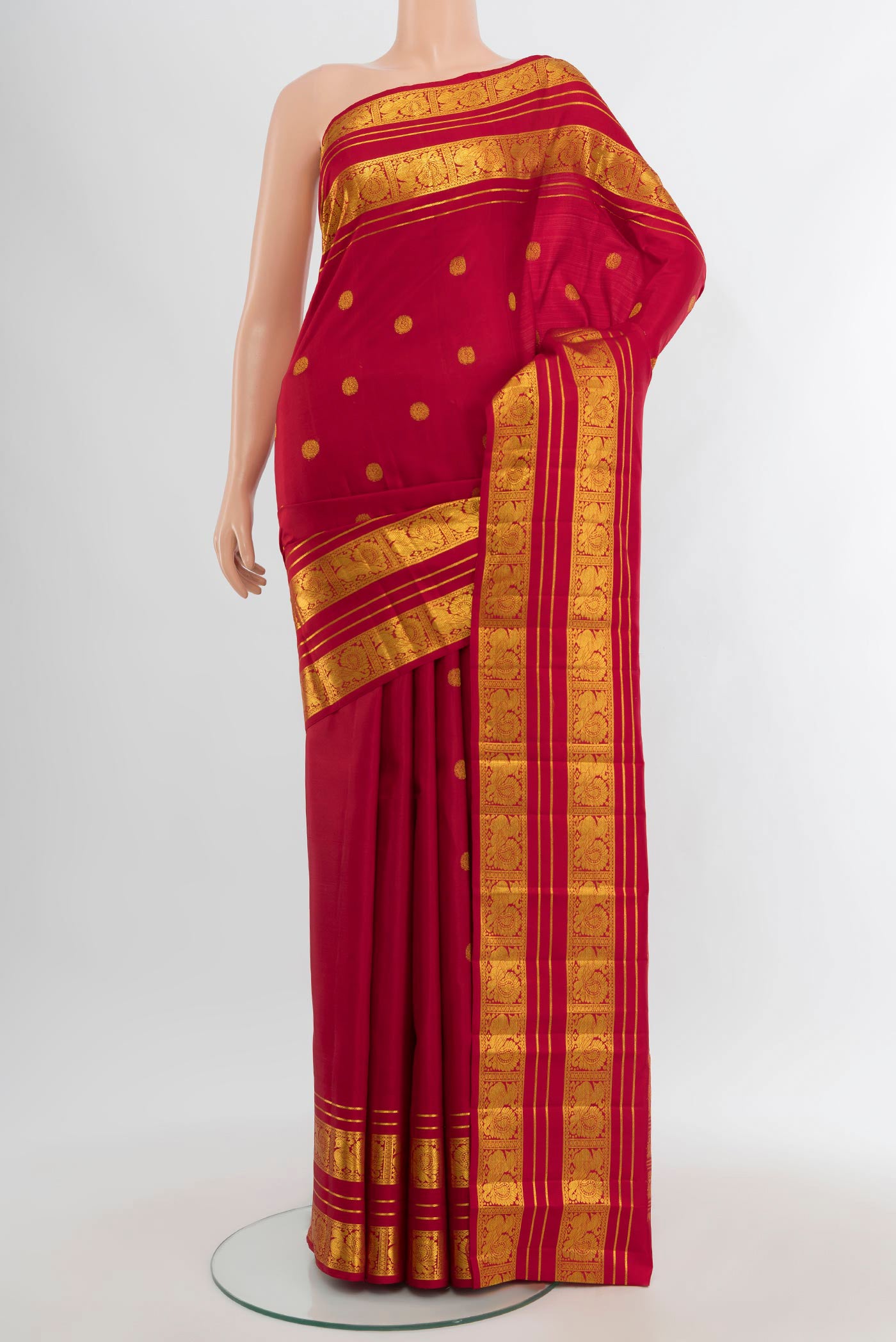 Red Kanjivaram Silk Saree with Zari Butta on the body and Zari Border.  displayed on a mannequin