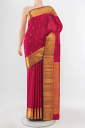 Pure Silk Pure Zari Peach Kanjivaram Saree with Zari Butta on the body and Silk Border.  displayed on a mannequin