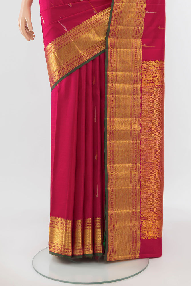 Pleats and pallu of Pure Silk Pure Zari Peach Kanjivaram Saree with Zari Butta on the body and Silk Border. 