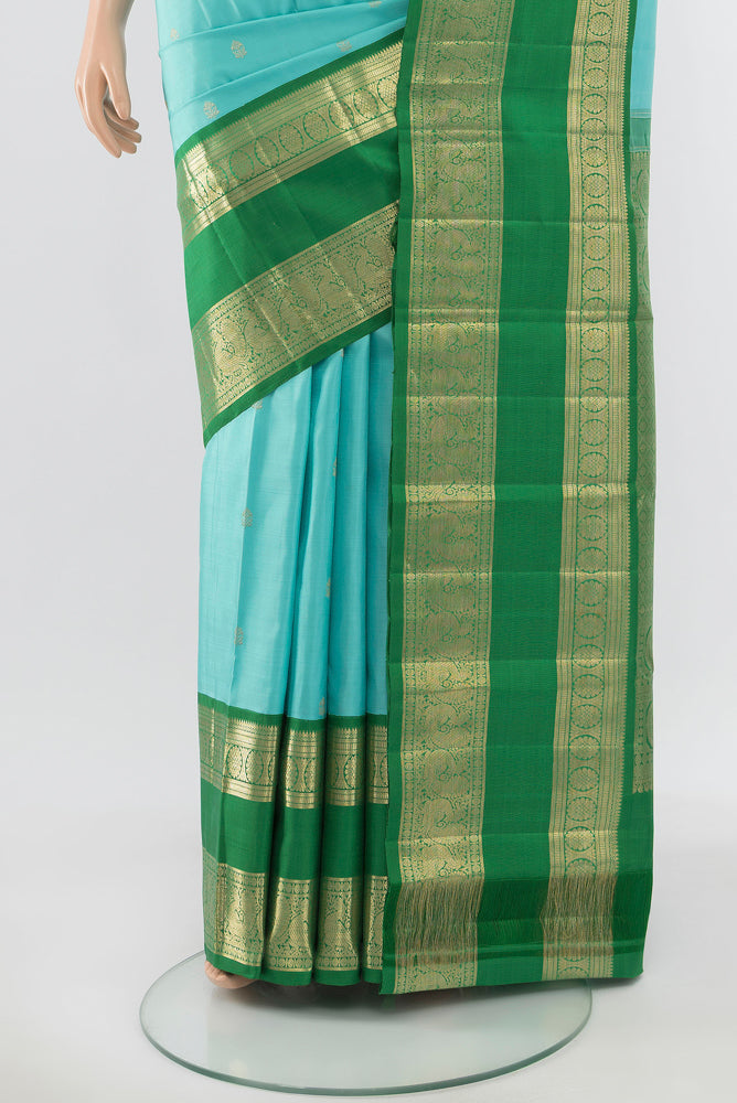 Pleats and pallu of Pure Silk Pure Zari Sky Blue Kanchipuram Saree with Zari Butta on the body and Silk Border. 
