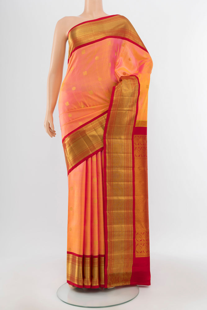 Pure Silk Pure Zari Peach Kanchipuram Saree with Zari Butta on the body and Silk Border.  displayed on a mannequin