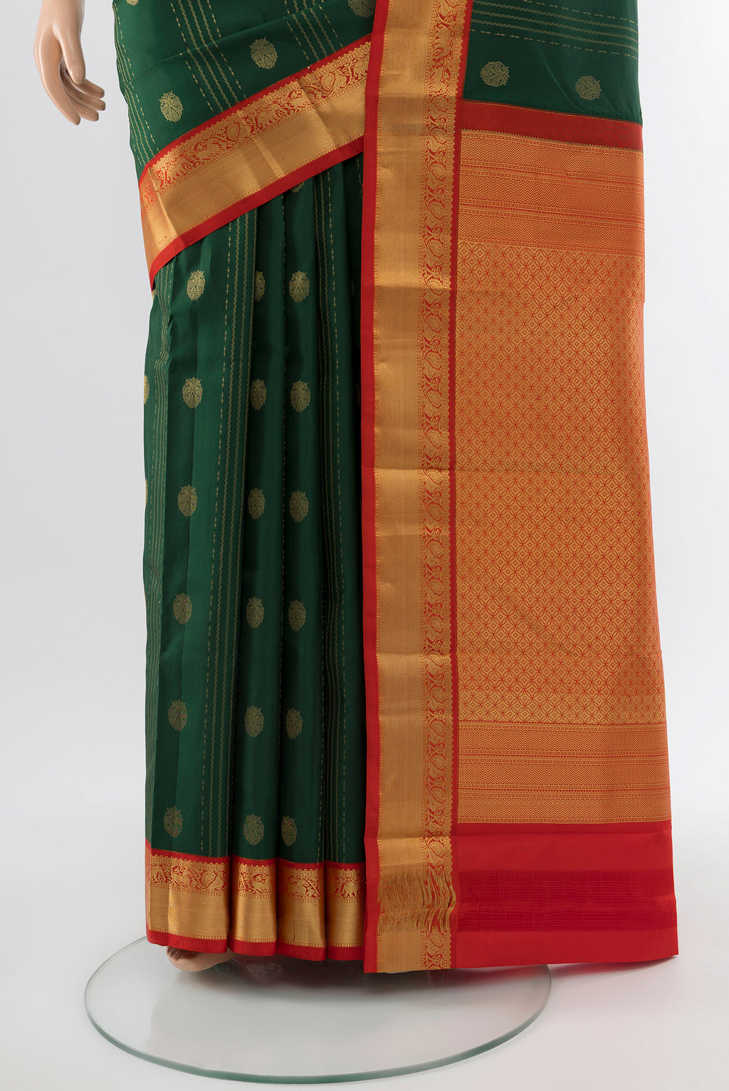 Pleats and pallu of Bottle Green Kanchipuram Silk Saree with Zari Butta on the body and Silk Border. 