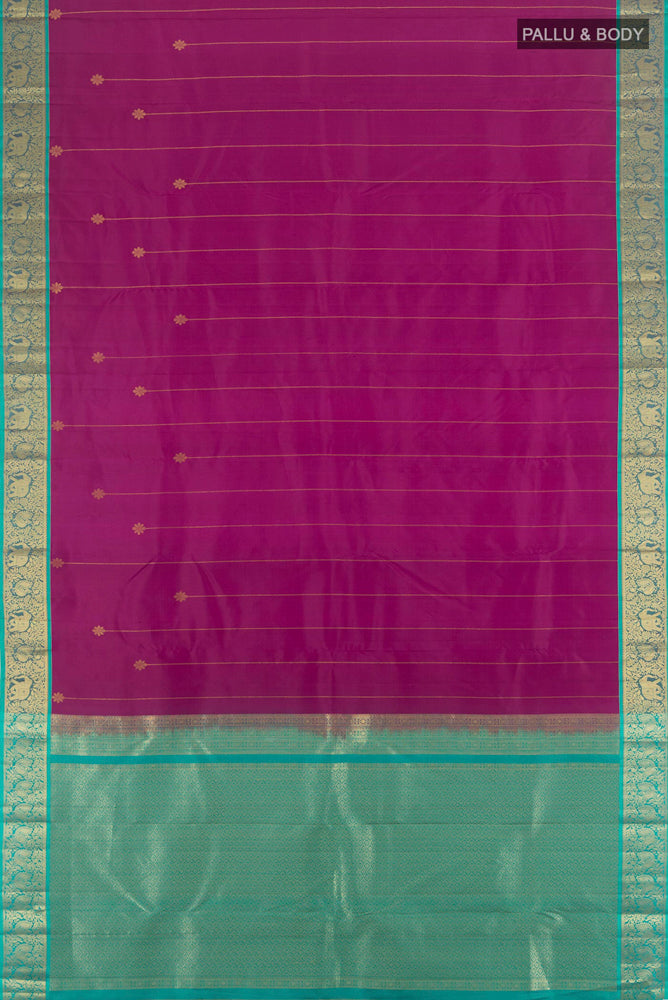 Flat view of Purple Kanchipuram Silk Saree with Zari Butta on the body and Silk Border. 