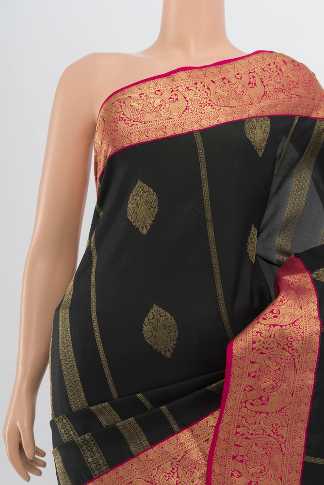 Border image of Black Kanchipuram Silk Saree with Zari Butta on the body and Silk Border. 