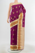 Pure Silk Pure Zari Purple Kanjivaram Saree with Zari Butta on the body and Silk Border.  displayed on a mannequin