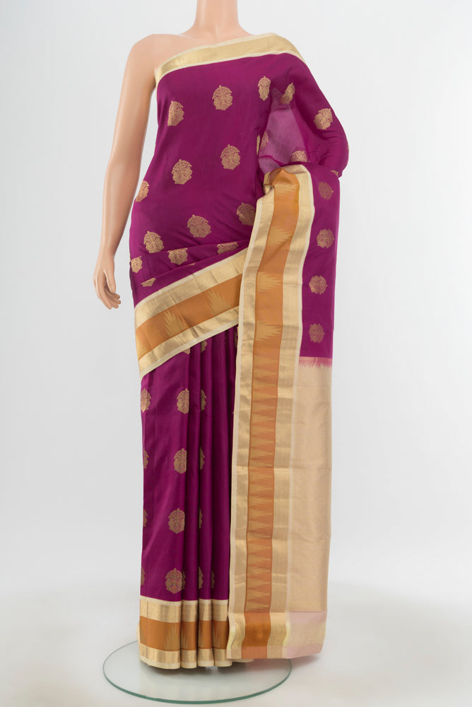 Pure Silk Pure Zari Purple Kanjivaram Saree with Zari Butta on the body and Silk Border.  displayed on a mannequin