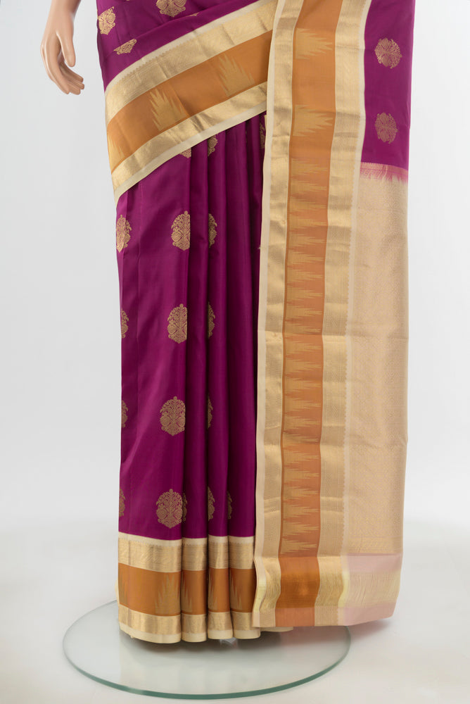 Pleats and pallu of Pure Silk Pure Zari Purple Kanjivaram Saree with Zari Butta on the body and Silk Border. 