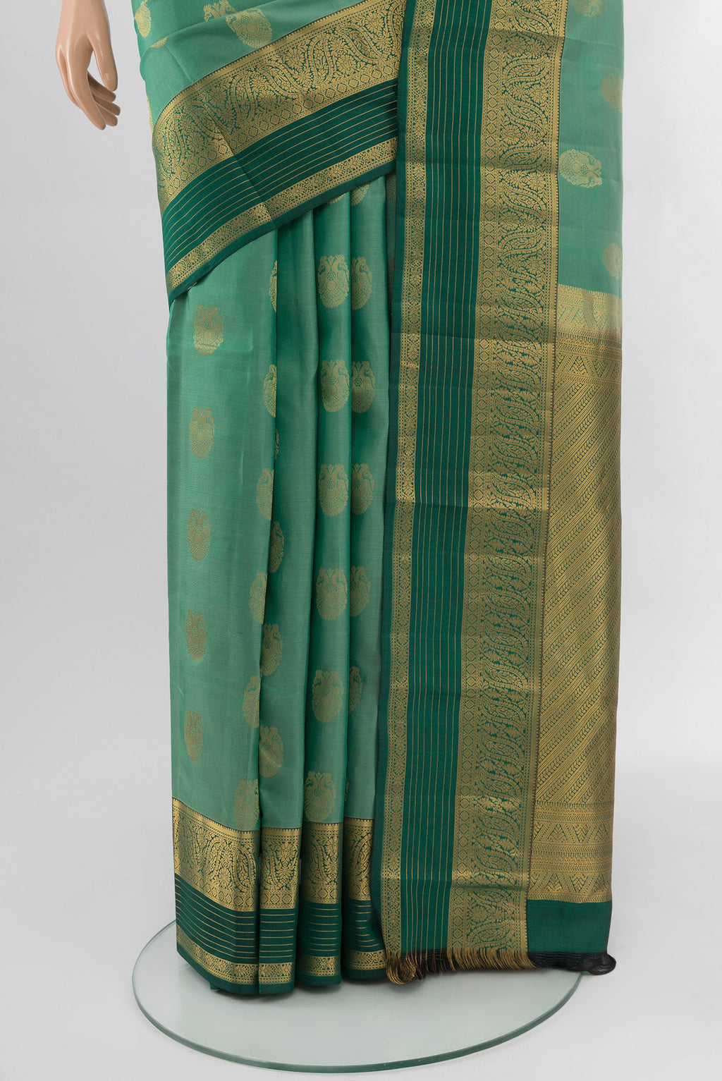 Pleats and pallu of Light Green Kanchipuram Silk Saree with Zari Butta on the body and Zari Border. 